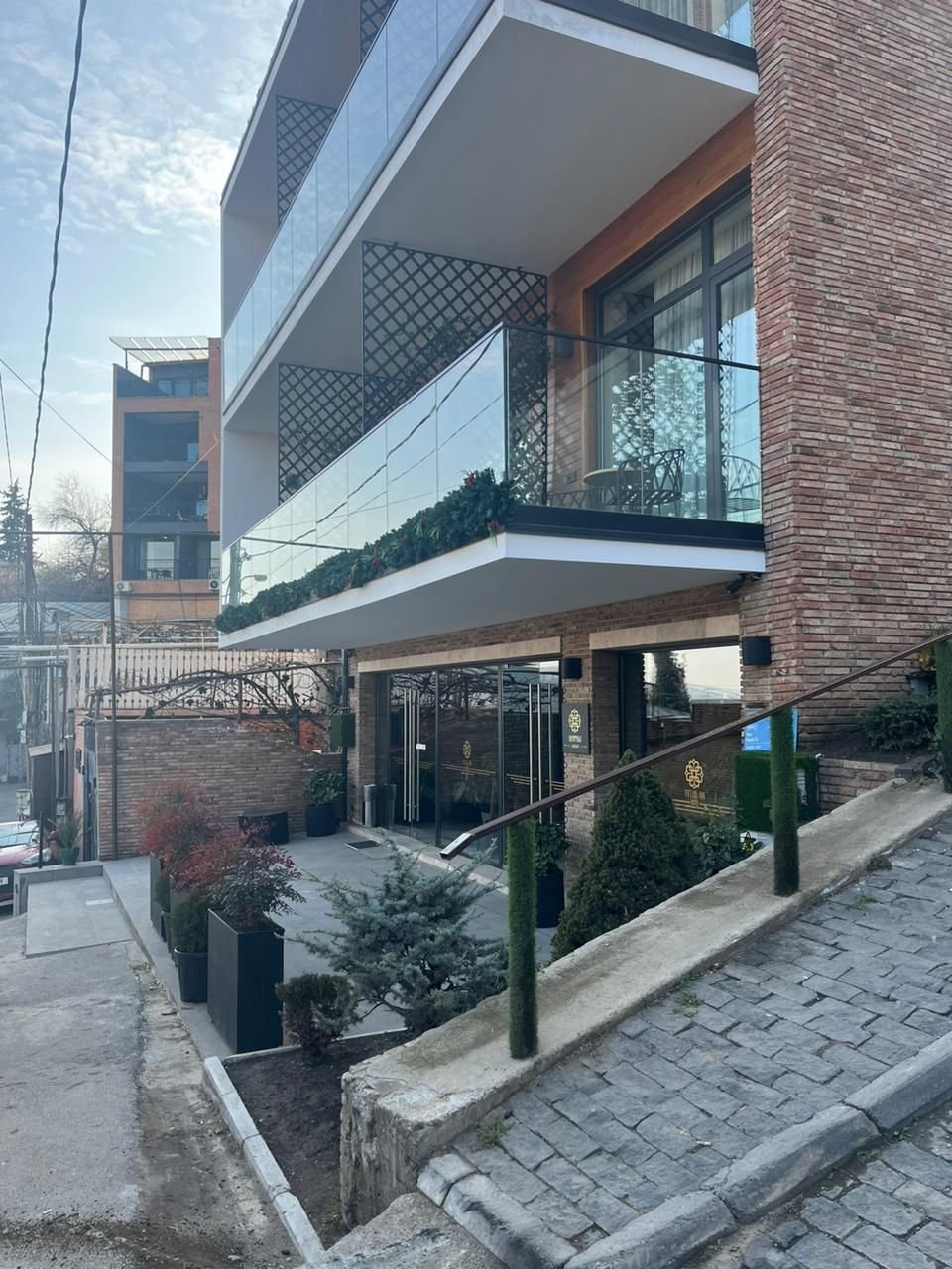 Safe glass railing on a terrace with a panoramic view.